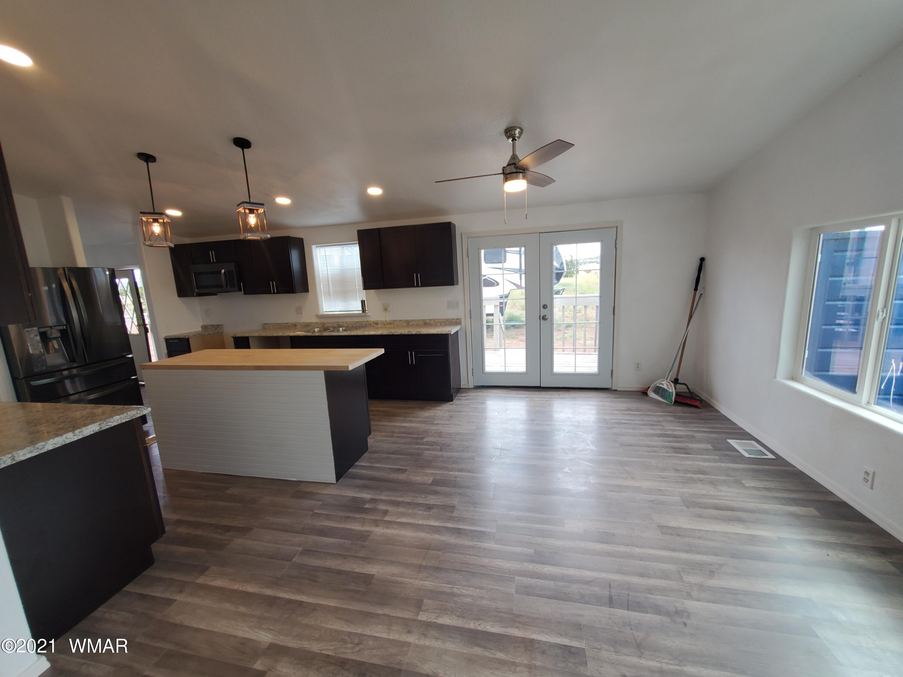 181 River Spings Ranch St. Johns, AZ 85936 - Photo 4 of 60 a view of kitchen with a sink a refrigerator and microwave