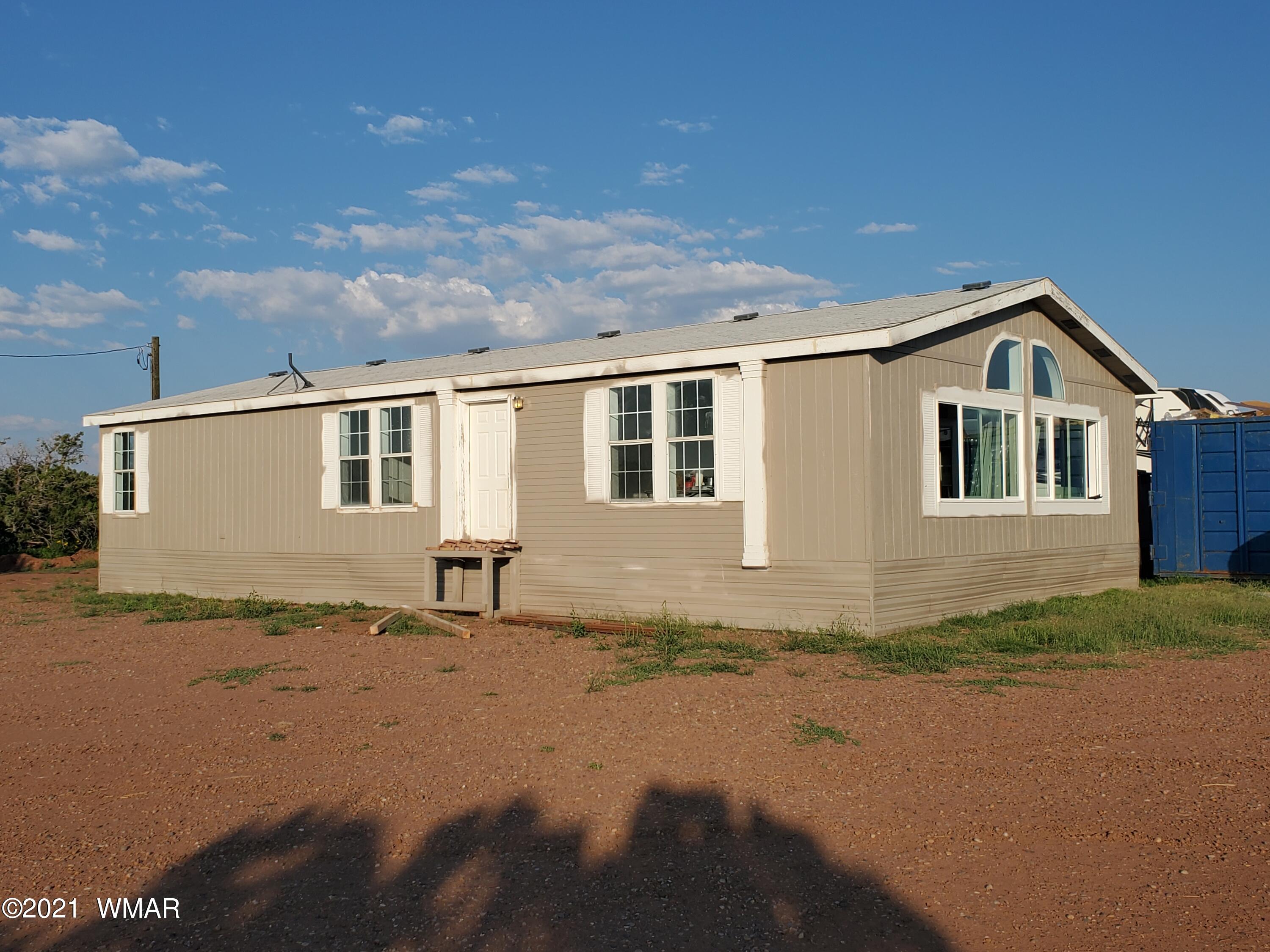 181 River Spings Ranch St. Johns, AZ 85936 - Photo 42 of 60 a front view of a house with a yard