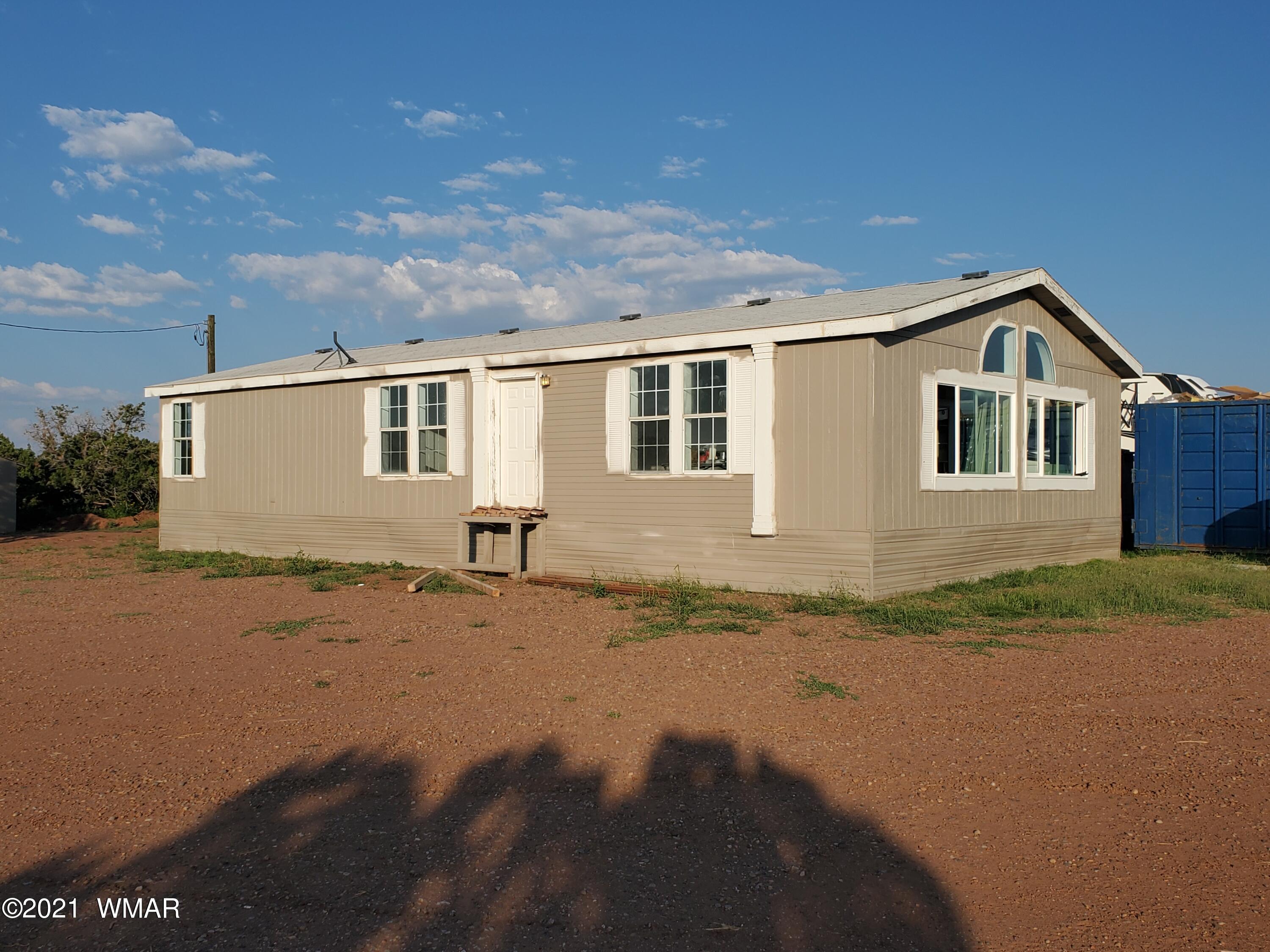 181 River Spings Ranch St. Johns, AZ 85936 - Photo 43 of 60 a front view of a house with a yard