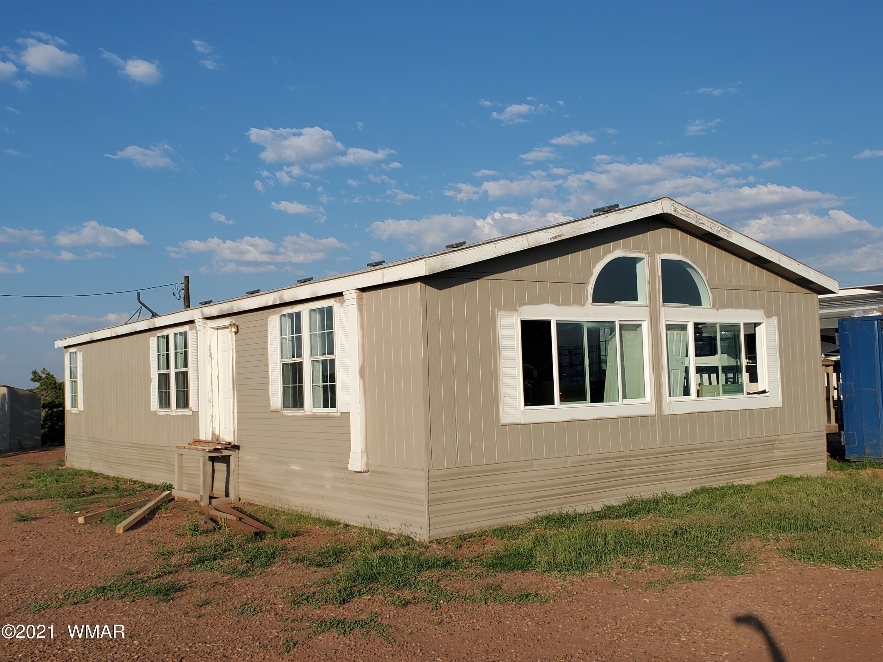 181 River Spings Ranch St. Johns, AZ 85936 - Photo 48 of 60 a front view of a house with a yard