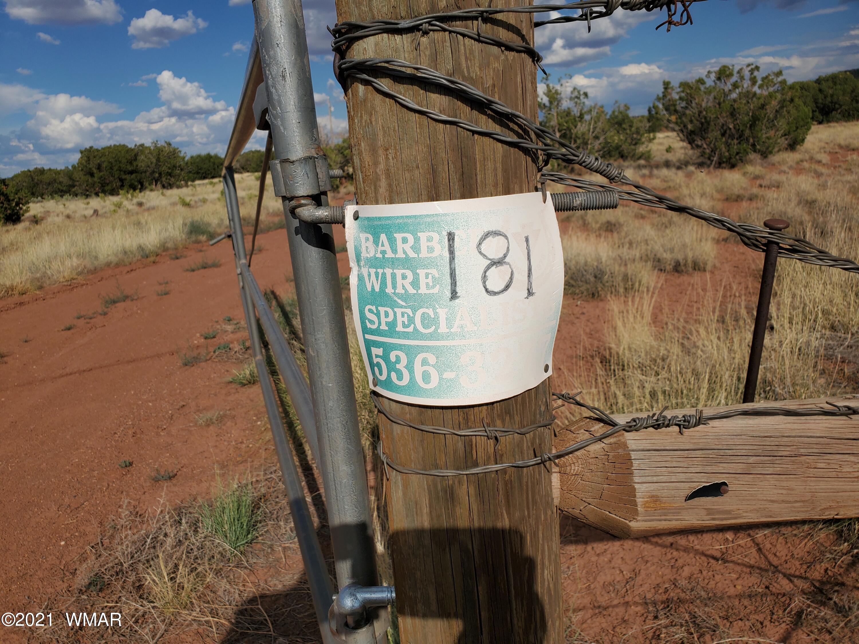 181 River Spings Ranch St. Johns, AZ 85936 - Photo 54 of 60 a sign on the side of a building