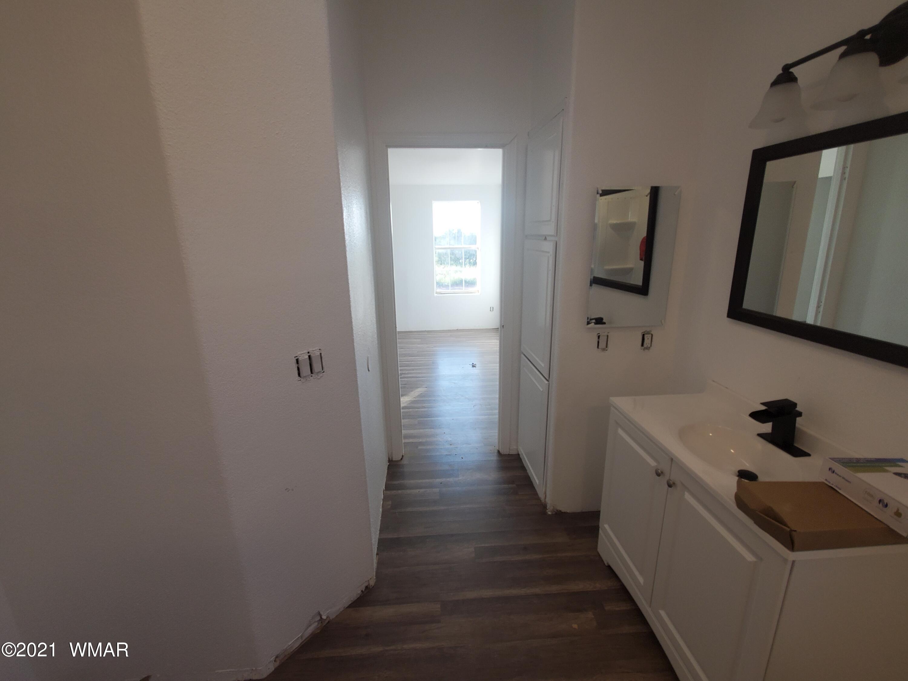 181 River Spings Ranch St. Johns, AZ 85936 - Photo 56 of 60 a hallway with washer and dryer