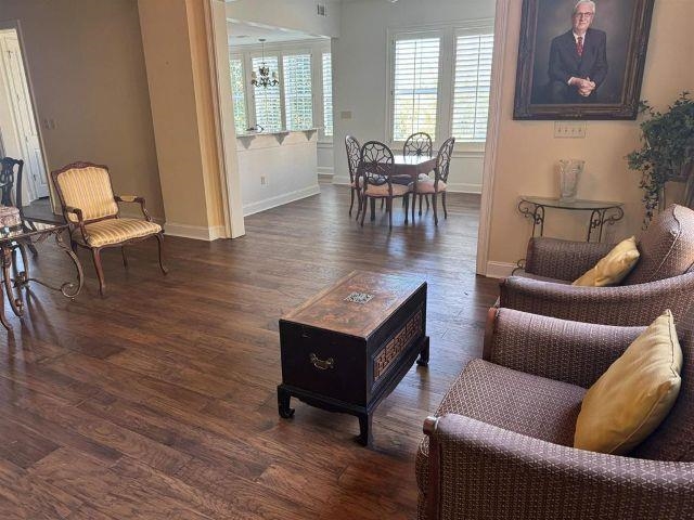 591 Lexington Road, Unit 201 Memphis, TN 38117 - Photo 6 of 11 a living room with furniture and a wooden floor