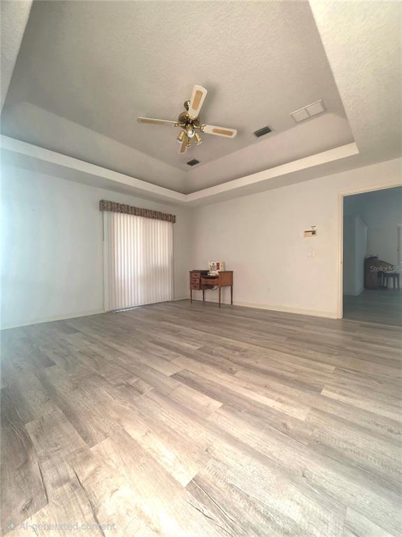 93 Hickory Loop Ocala, FL 34472 - Photo 14 of 23 a view of empty room with window and ceiling fan