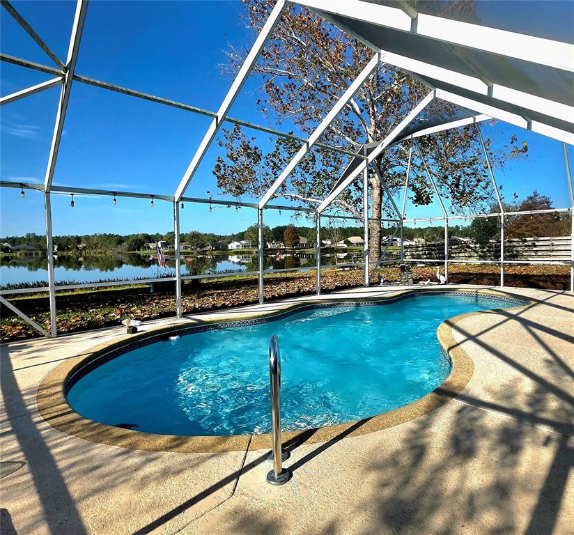 93 Hickory Loop Ocala, FL 34472 - Photo 20 of 23 a view of a backyard with a patio and wooden fence