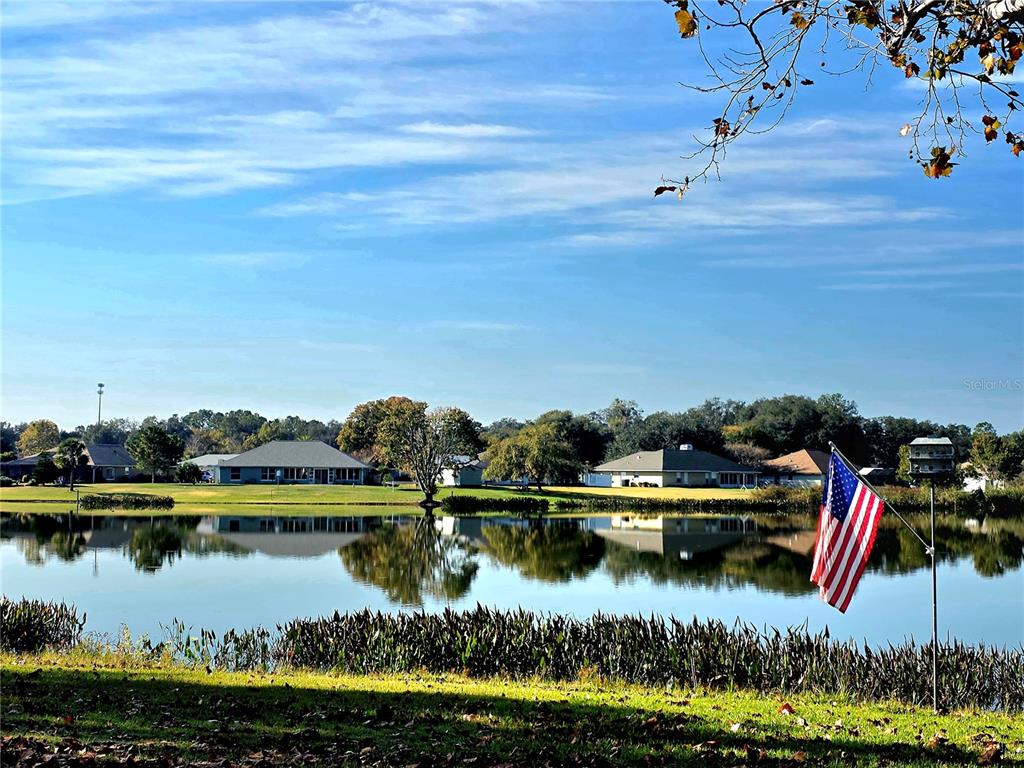 93 Hickory Loop Ocala, FL 34472 - Photo 22 of 23 a view of a lake with a city