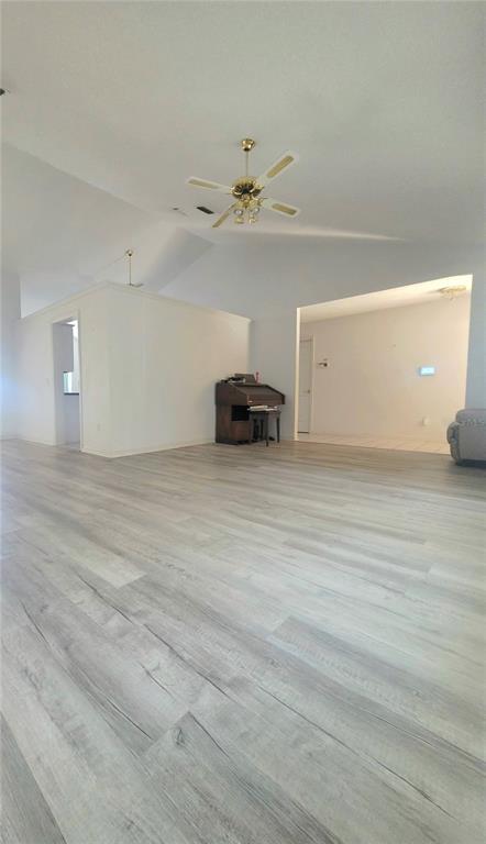93 Hickory Loop Ocala, FL 34472 - Photo 6 of 23 a view of a livingroom with a stove and a ceiling fan