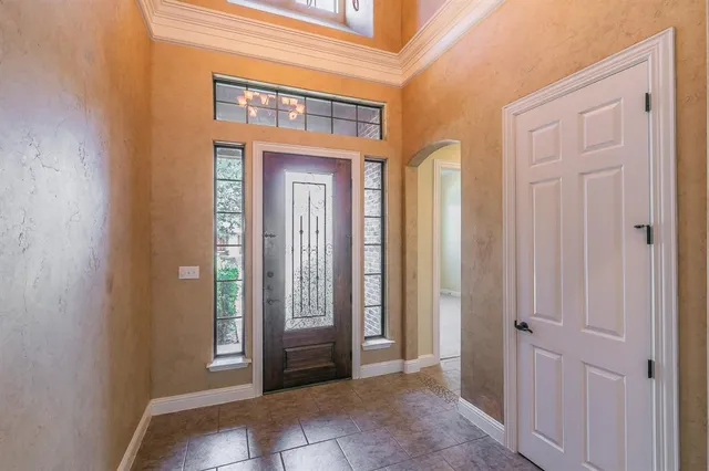 a view of a hallway with front door