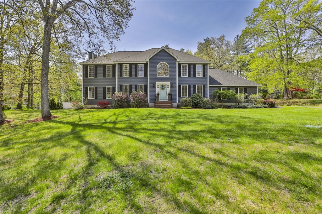 32 Glance Road Windham, NH 03087 - Photo 1 of 42 a view of a big house with a big yard and large trees
