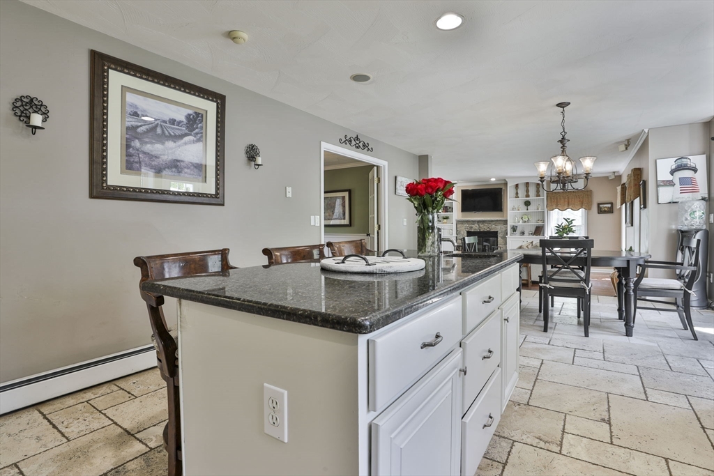 32 Glance Road Windham, NH 03087 - Photo 16 of 42 a kitchen with center island table and chairs