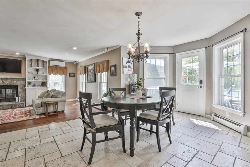 32 Glance Road Windham, NH 03087 - Photo 17 of 42 a view of a dining room with furniture window and outside view