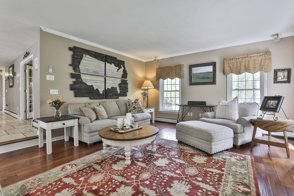 32 Glance Road Windham, NH 03087 - Photo 20 of 42 a living room with furniture and a large window
