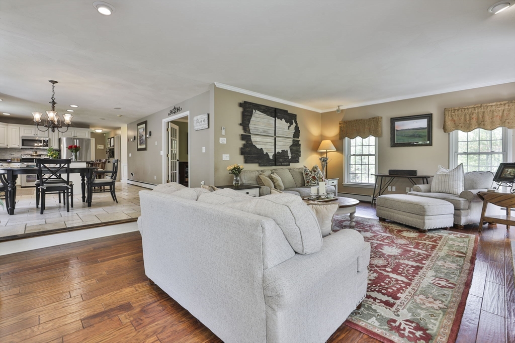 32 Glance Road Windham, NH 03087 - Photo 21 of 42 a living room with furniture and a dining table