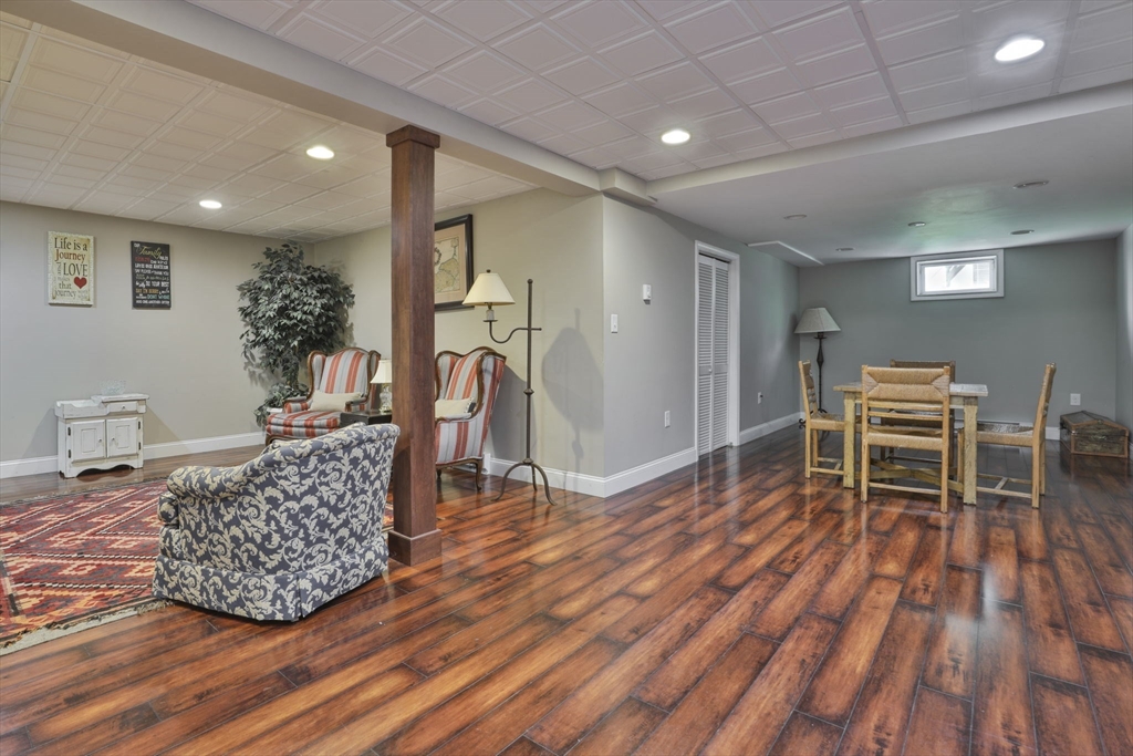 32 Glance Road Windham, NH 03087 - Photo 35 of 42 a living room with furniture a piano and wooden floor