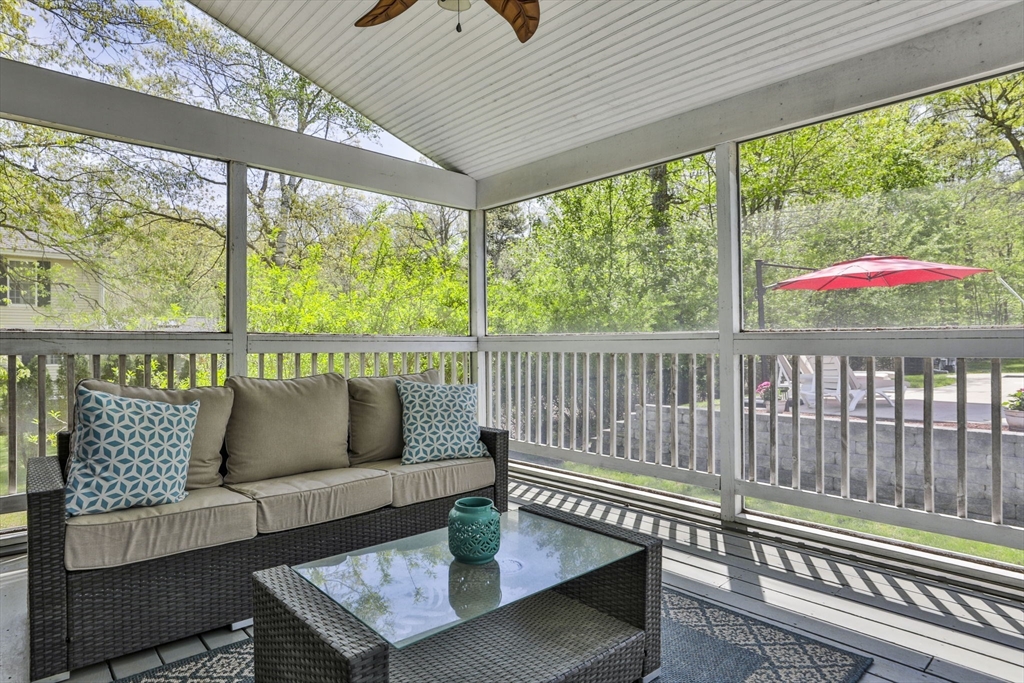 32 Glance Road Windham, NH 03087 - Photo 37 of 42 a roof deck with couch and wooden floor