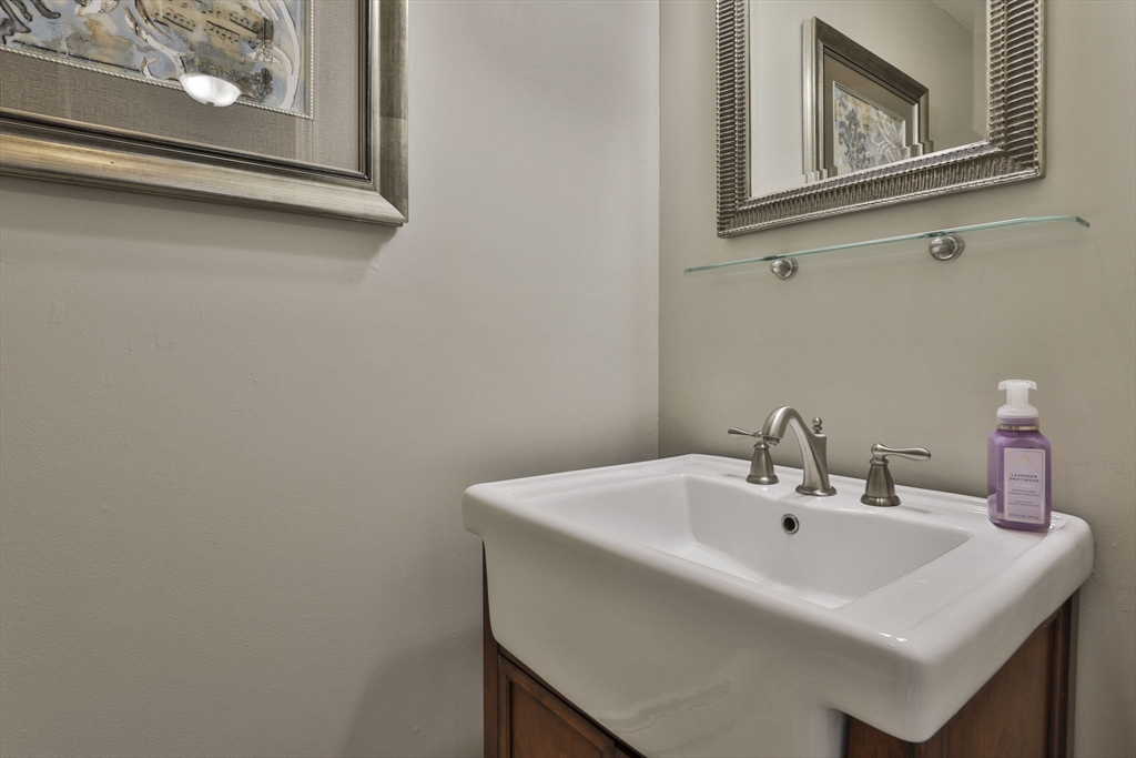 32 Glance Road Windham, NH 03087 - Photo 9 of 42 a bathroom with a sink and a mirror