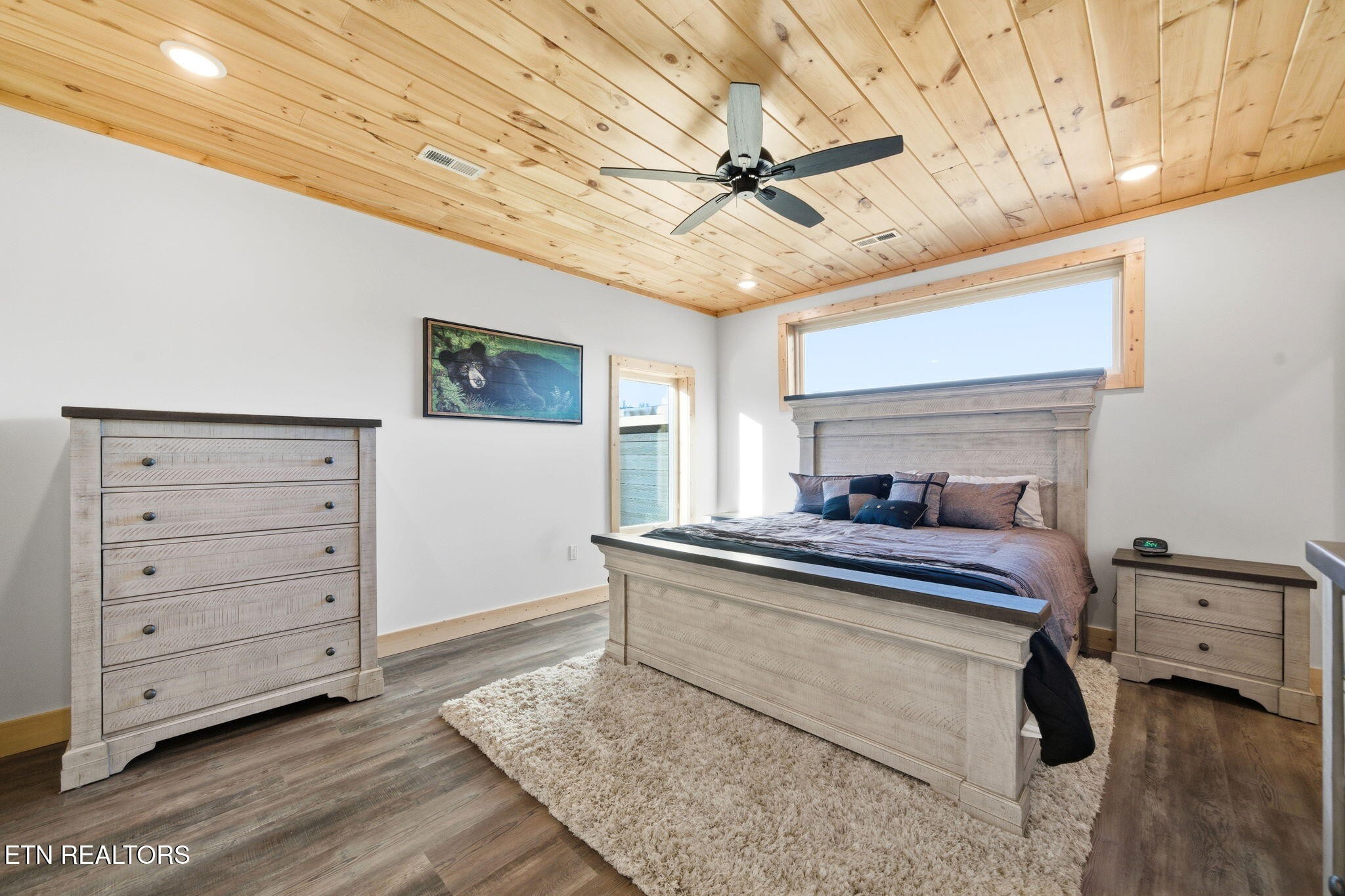 644 Ridge Top Loop Gatlinburg, TN 37738 - Photo 12 of 32 a bedroom with a bed and a chandelier