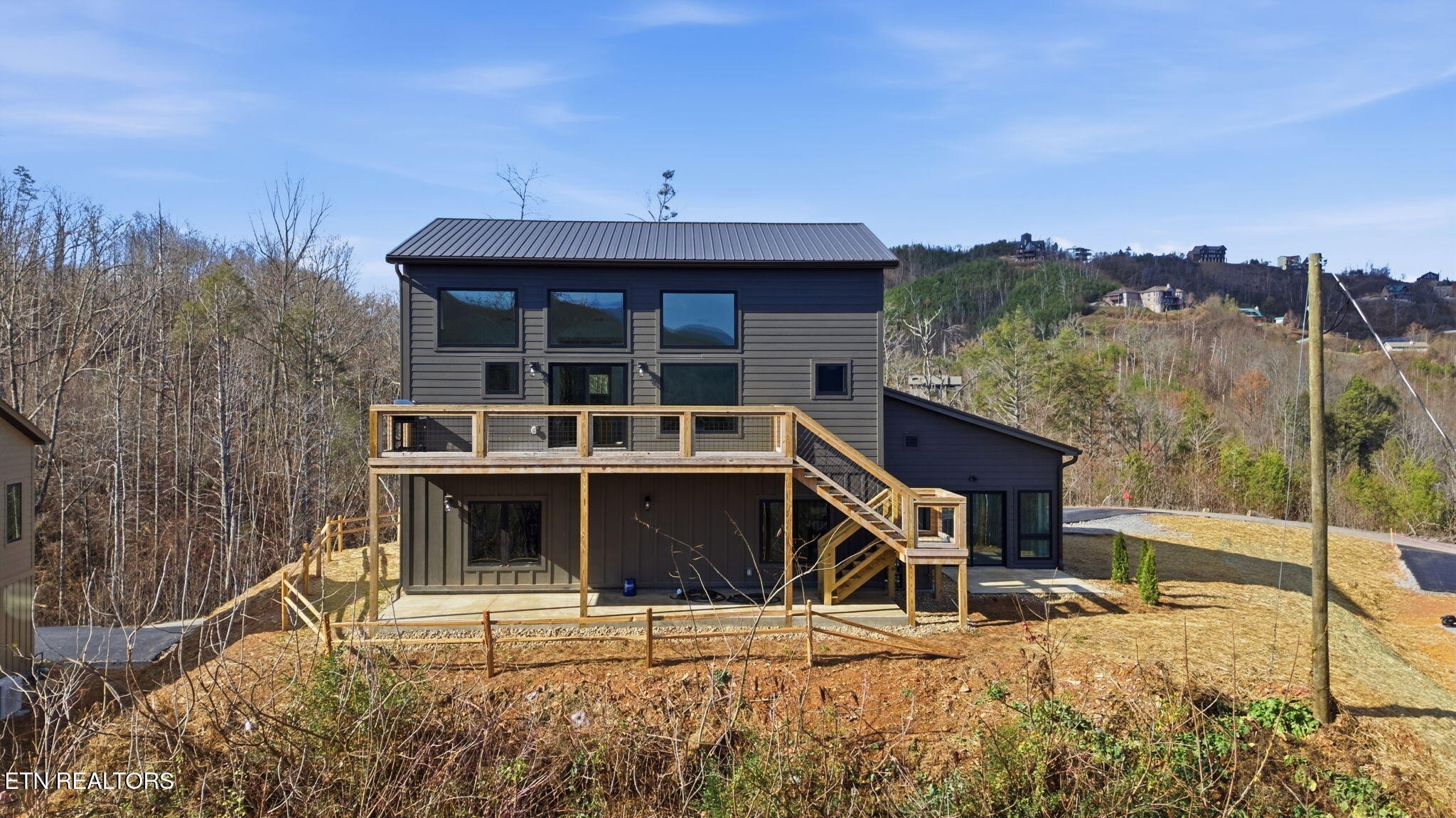 644 Ridge Top Loop Gatlinburg, TN 37738 - Photo 30 of 32 a front view of a house with a yard