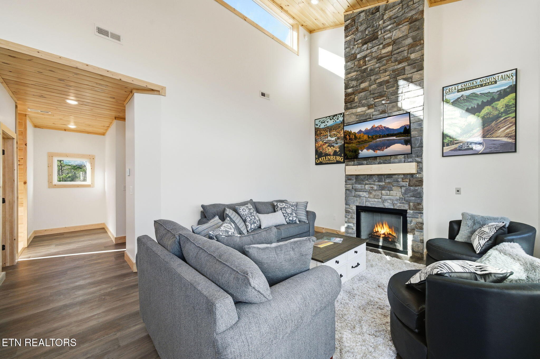644 Ridge Top Loop Gatlinburg, TN 37738 - Photo 5 of 32 a living room with furniture a flat screen tv and a fireplace