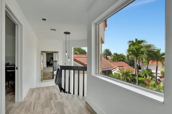 a bathroom with a bathtub sink and mirror