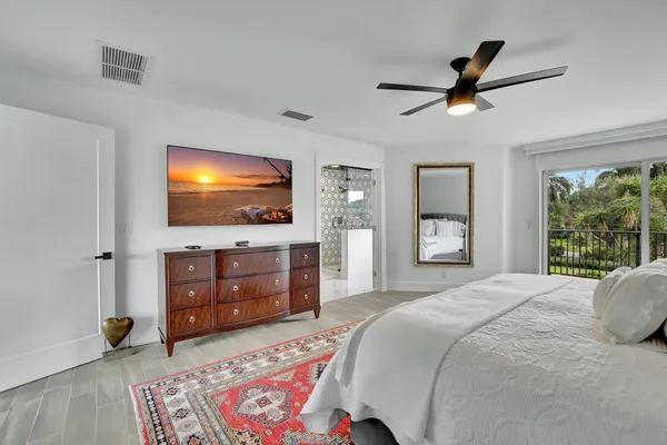 a kitchen with stainless steel appliances granite countertop a sink and cabinets with wooden floor