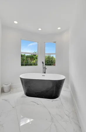 an aerial view of residential houses with outdoor space and street view