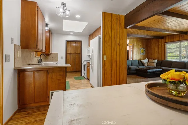 a bedroom with a bed and a large mirror