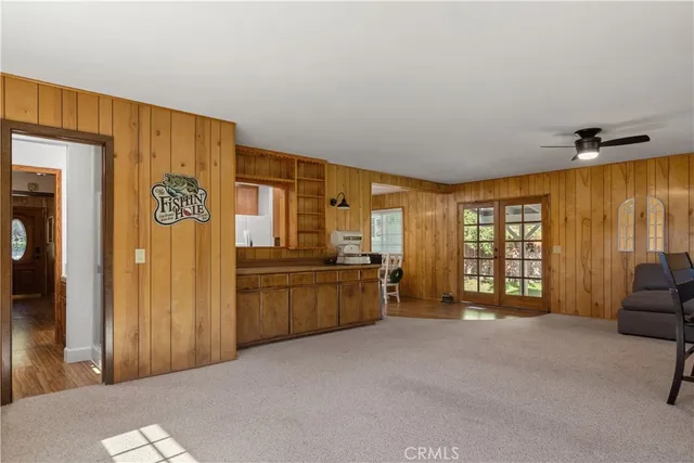 a large bedroom with a large window and furniture
