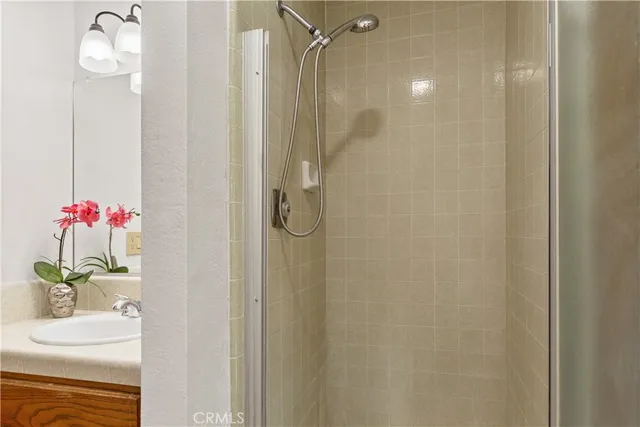 a bathroom with a shower curtain and a sink
