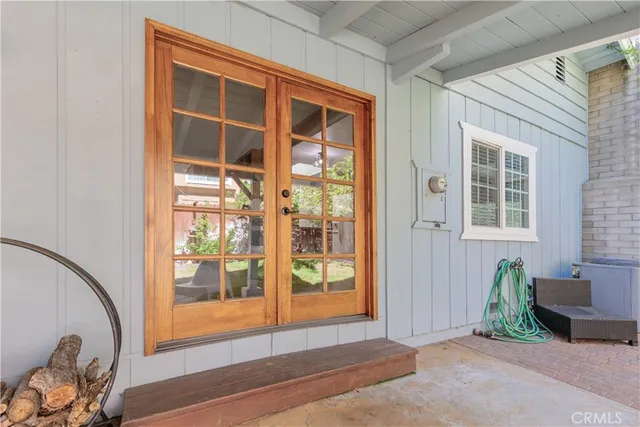 a view of a door and chair in front of a house