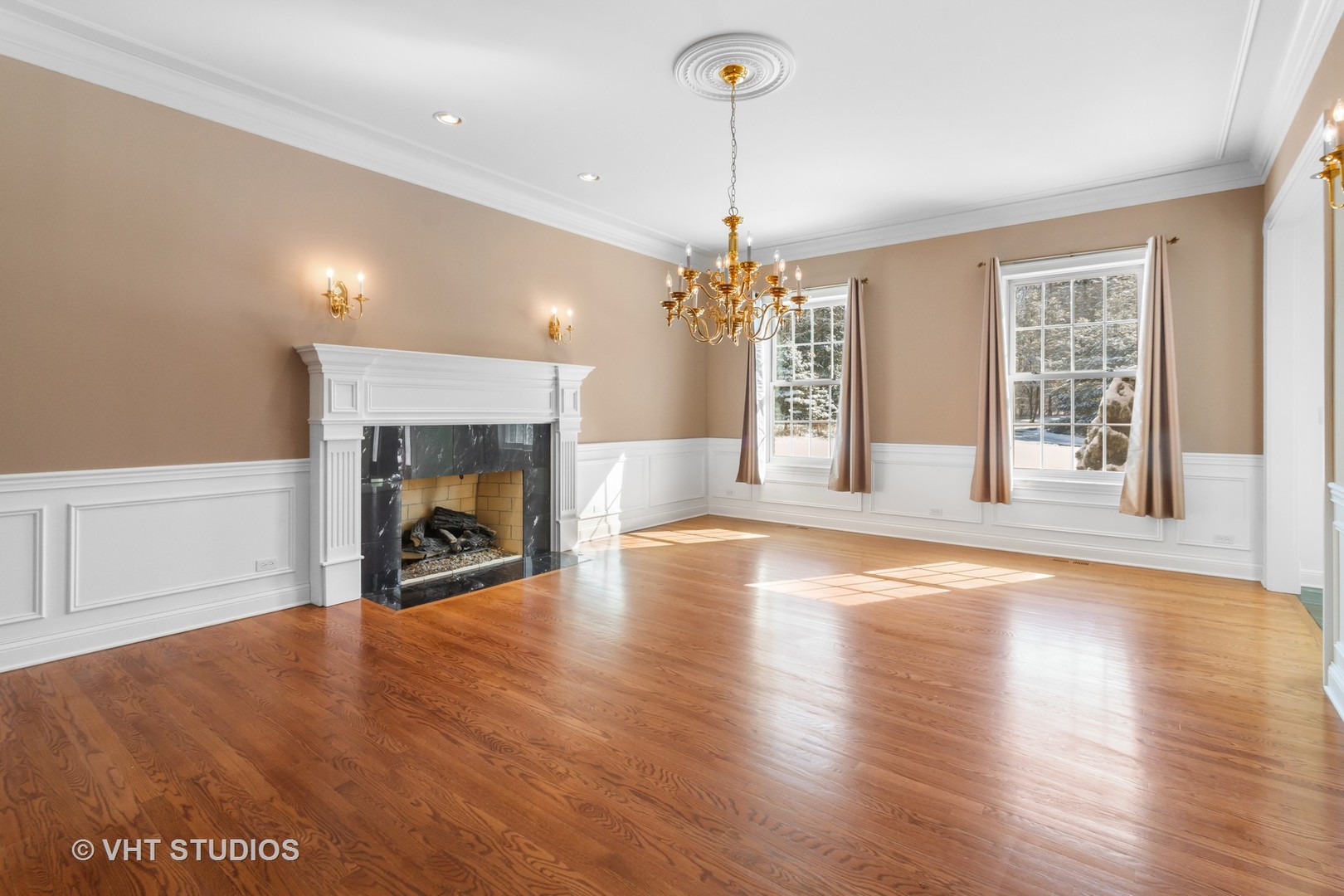 8702 Bull Valley Road Bull Valley, IL 60098 - Photo 13 of 30 a view of a livingroom with wooden floor a fireplace and window