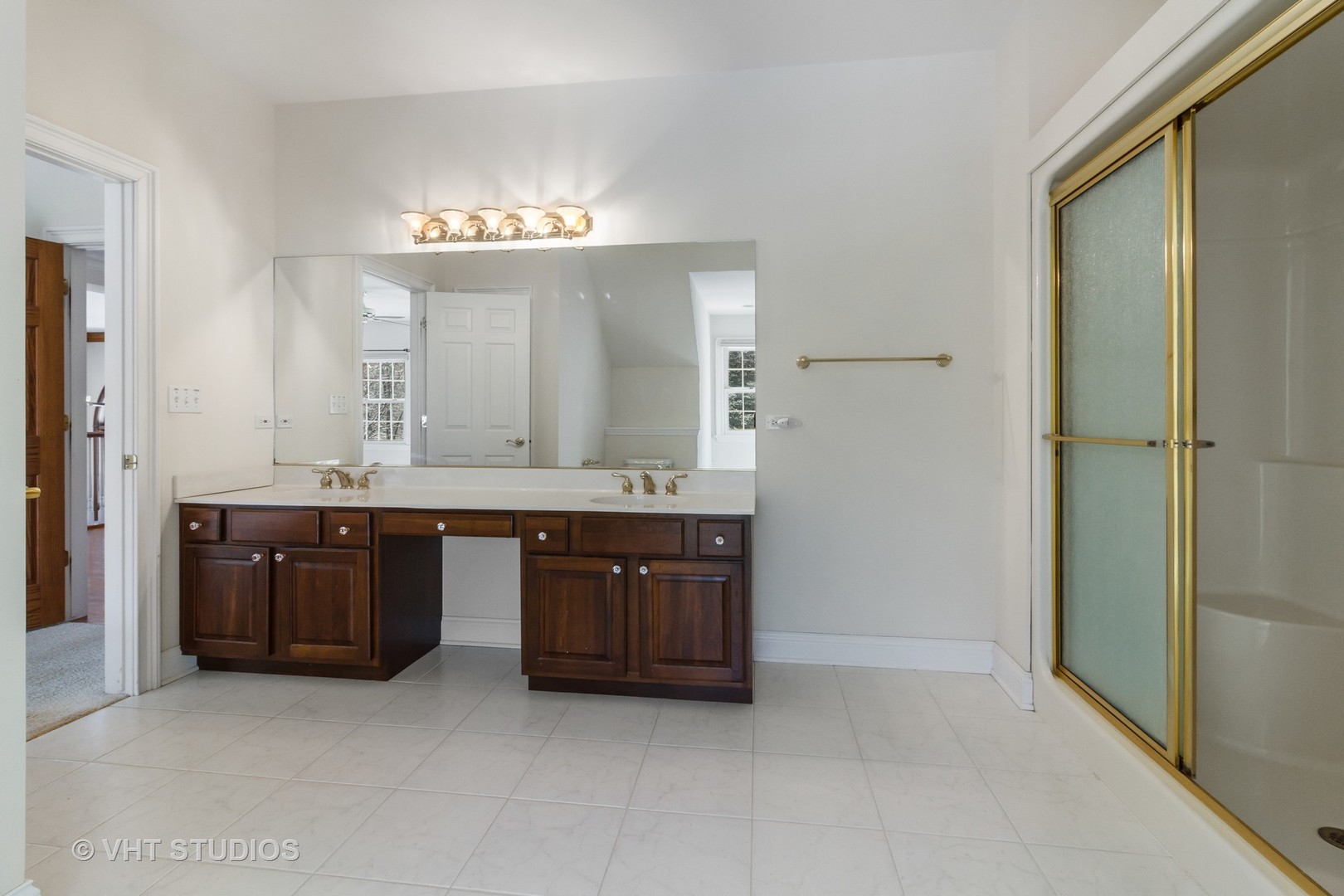 8702 Bull Valley Road Bull Valley, IL 60098 - Photo 24 of 30 a bathroom with a granite countertop double vanity sink and a mirror