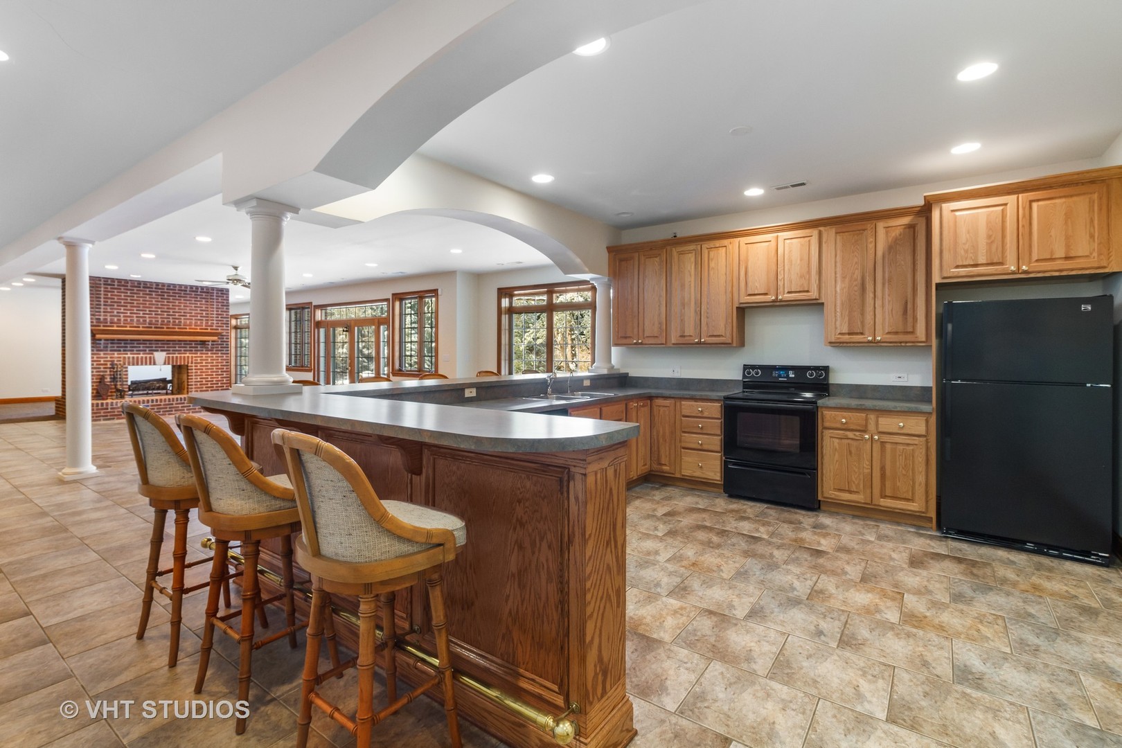 8702 Bull Valley Road Bull Valley, IL 60098 - Photo 25 of 30 a kitchen with a table chairs refrigerator and cabinets