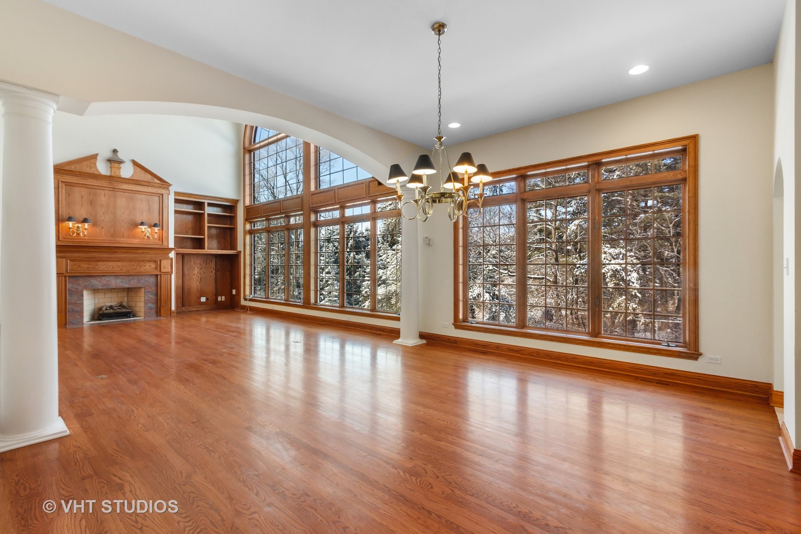 8702 Bull Valley Road Bull Valley, IL 60098 - Photo 7 of 30 a view of a big room with wooden floor windows and chandelier
