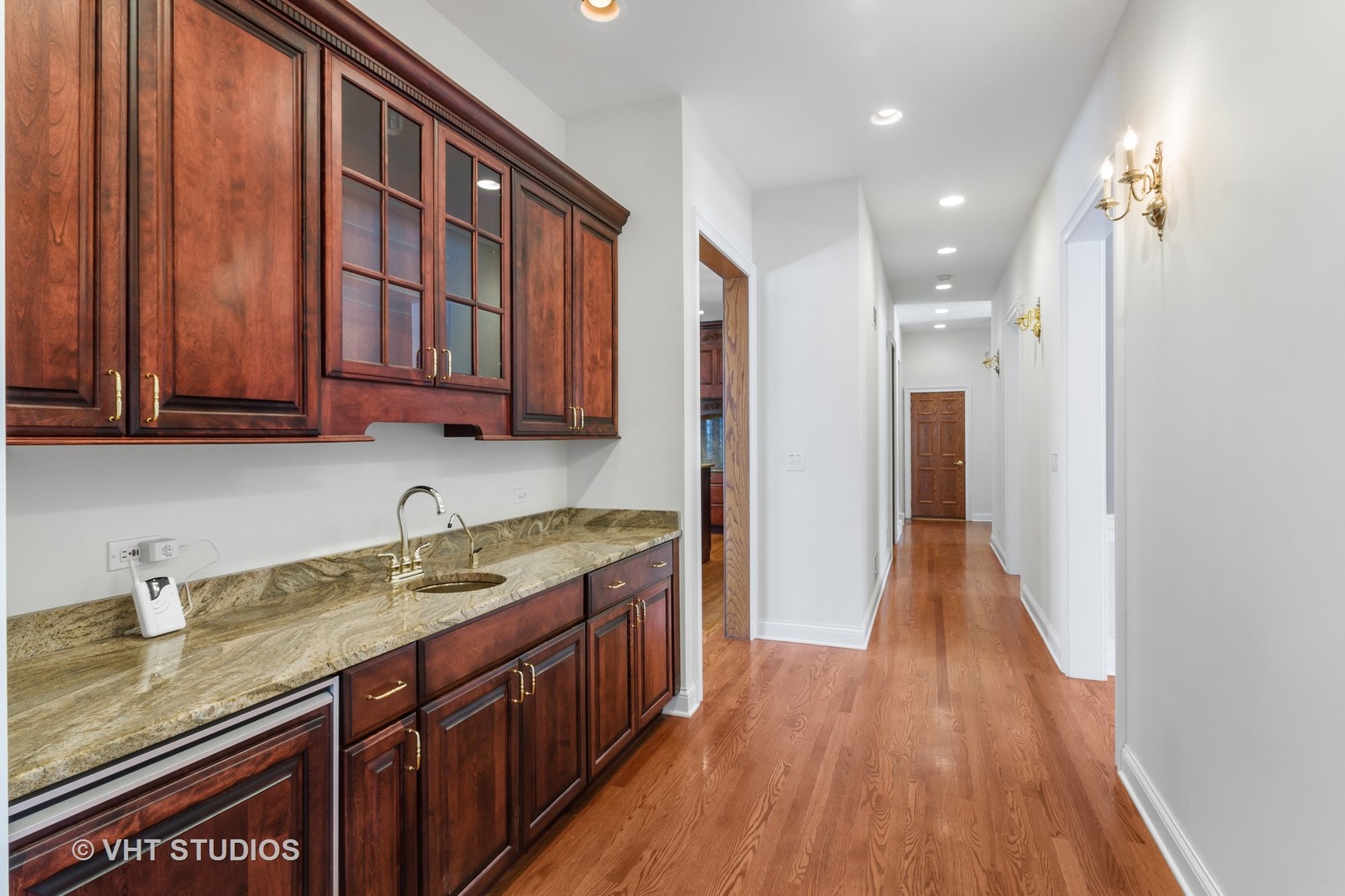8702 Bull Valley Road Bull Valley, IL 60098 - Photo 10 of 30 a kitchen with stainless steel appliances granite countertop a sink stove and cabinets