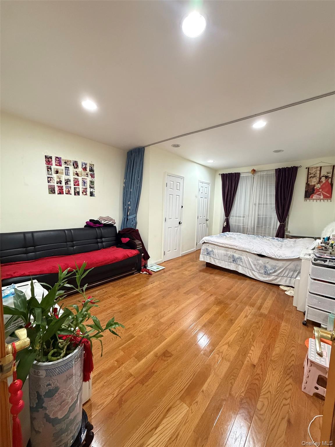 134-39 Blossom Avenue, Unit 2G Queens, NY 11355 - Photo 3 of 5 Bedroom with light wood-style flooring and recessed lighting