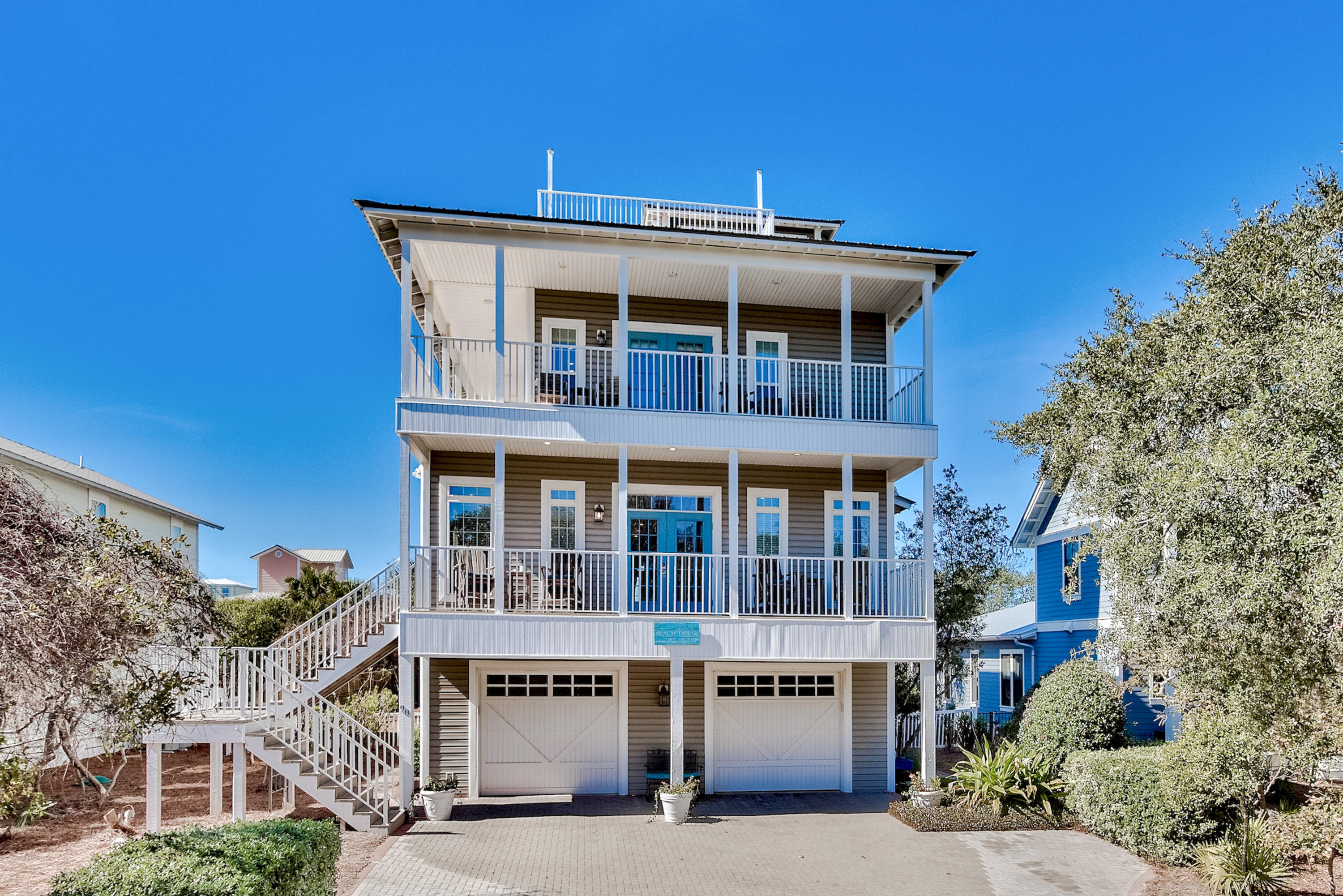 98 Gulf Point Road Santa Rosa Beach, FL 32459 - Photo 1 of 75 a front view of a building with a garden