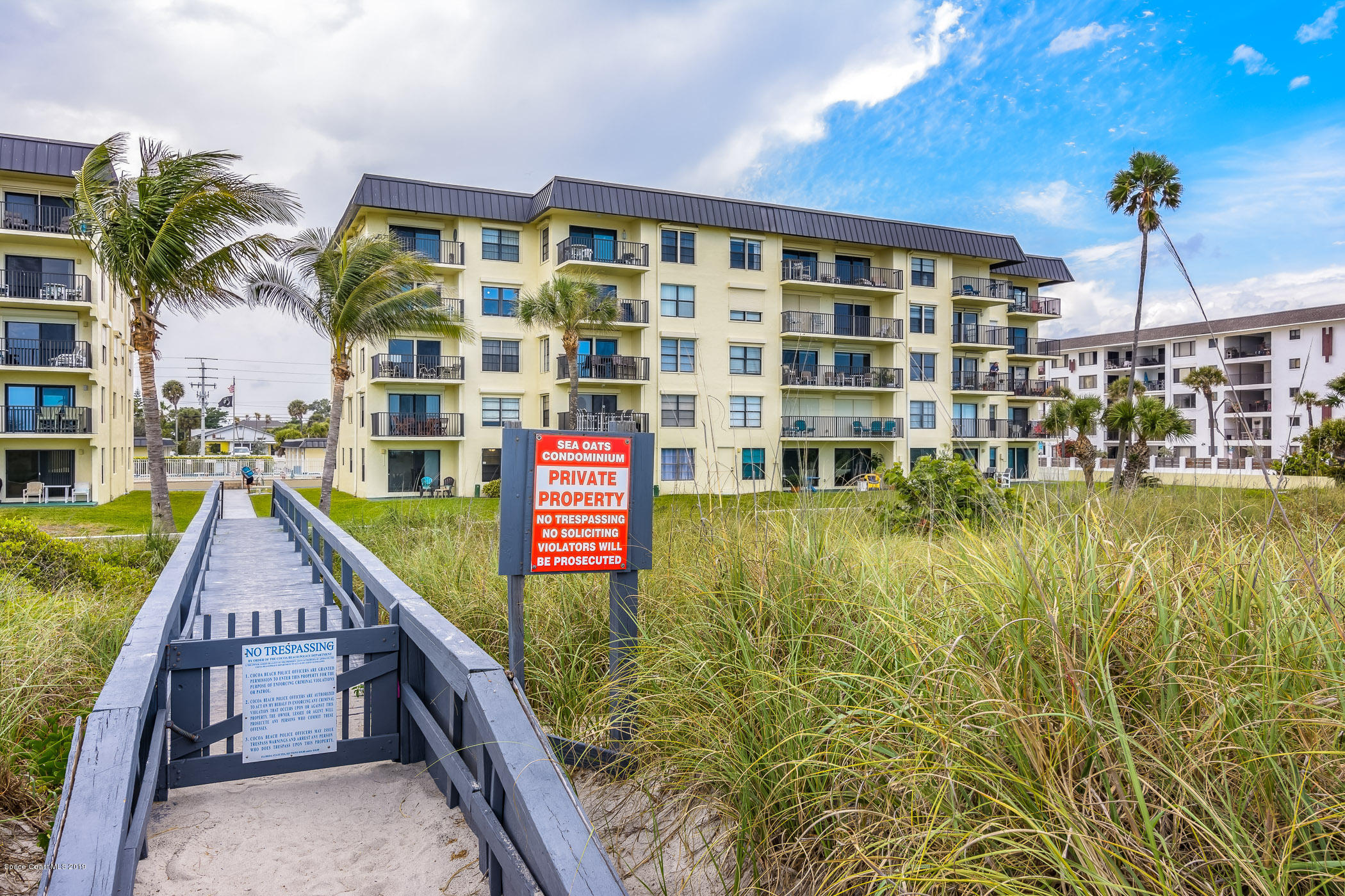 4570 Ocean Beach Boulevard, Unit 106 Cocoa Beach, FL 32931 - Photo 2 of 39 a house view with a outdoor space