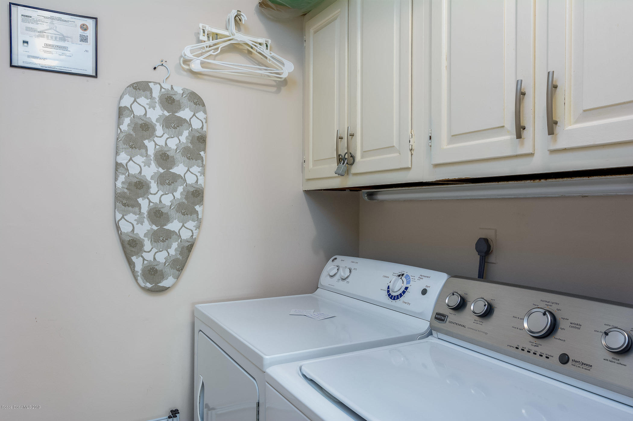 4570 Ocean Beach Boulevard, Unit 106 Cocoa Beach, FL 32931 - Photo 19 of 39 a utility room with dryer and washer