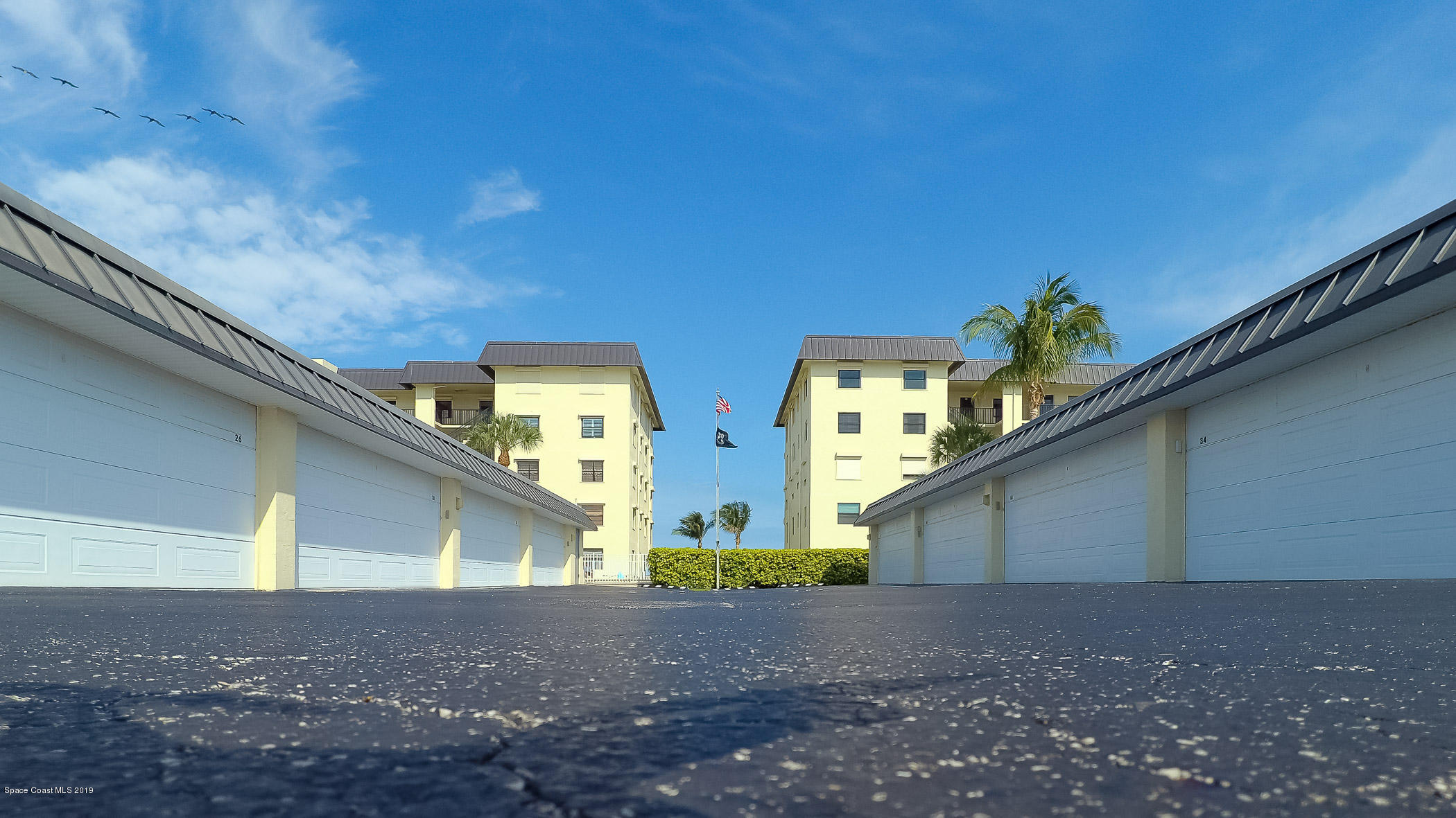 4570 Ocean Beach Boulevard, Unit 106 Cocoa Beach, FL 32931 - Photo 21 of 39 a view of outdoor space and yard