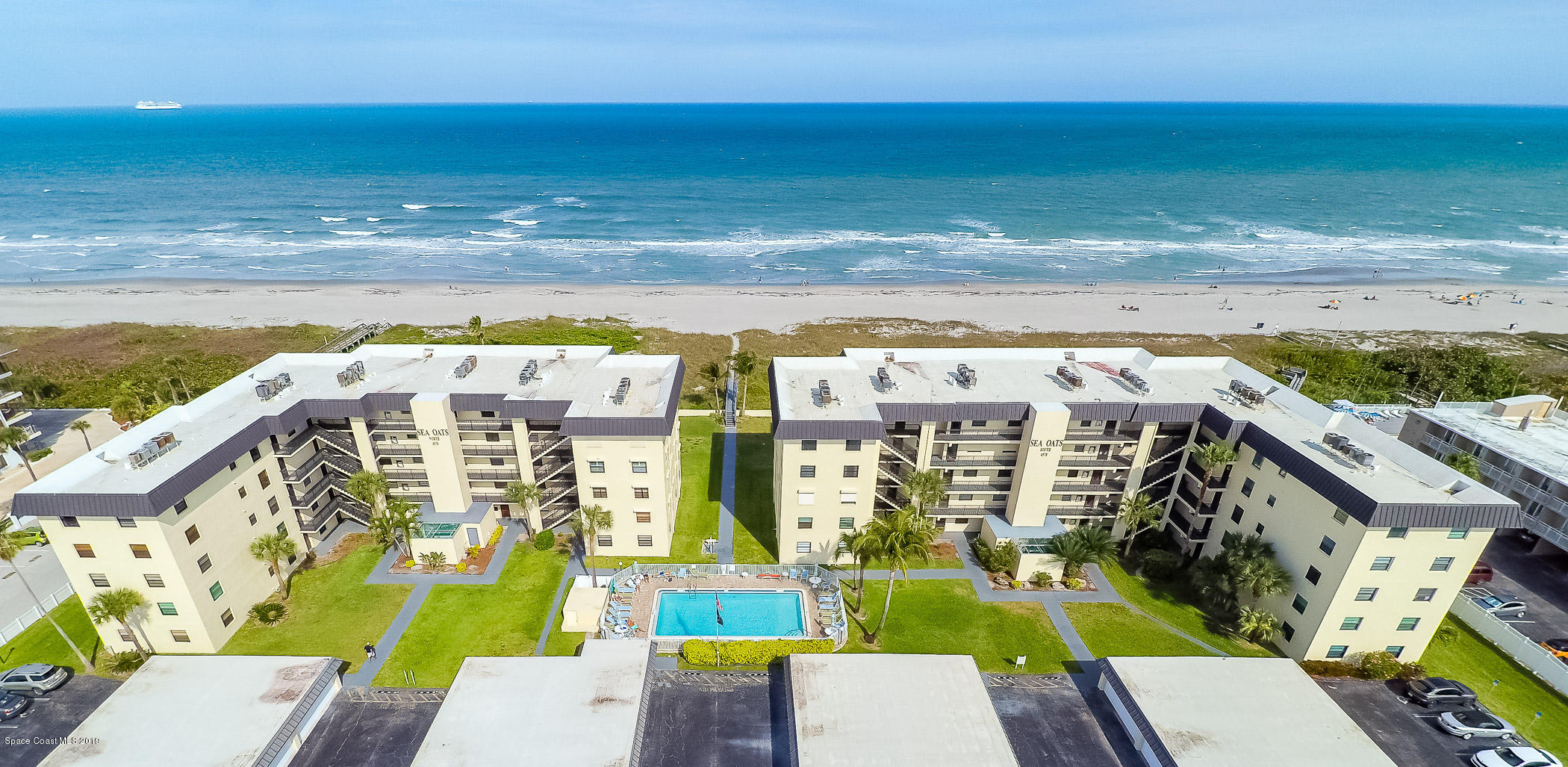 4570 Ocean Beach Boulevard, Unit 106 Cocoa Beach, FL 32931 - Photo 25 of 39 a view of swimming pool with an ocean view