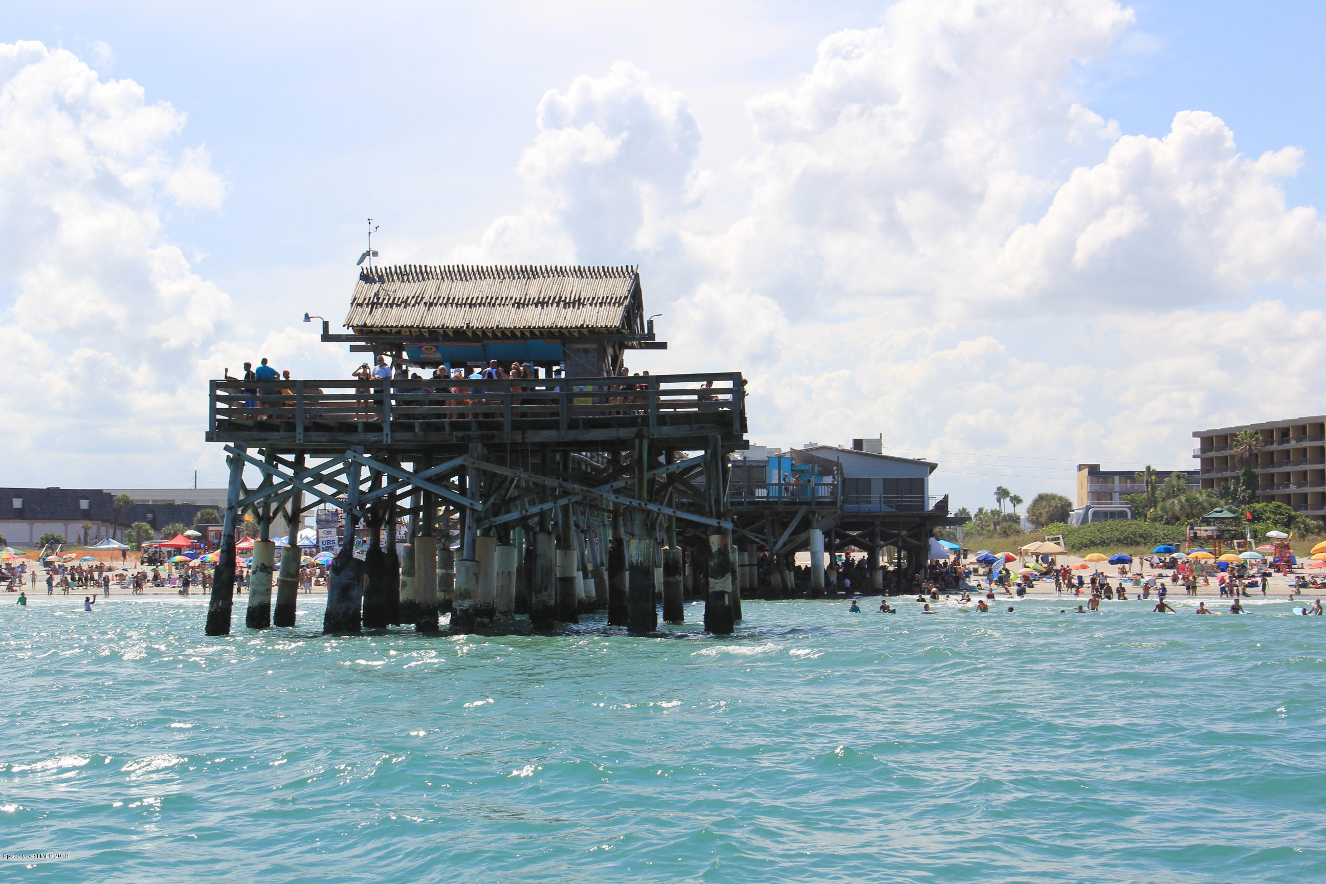 4570 Ocean Beach Boulevard, Unit 106 Cocoa Beach, FL 32931 - Photo 30 of 39 a view of a big yard with wooden fence