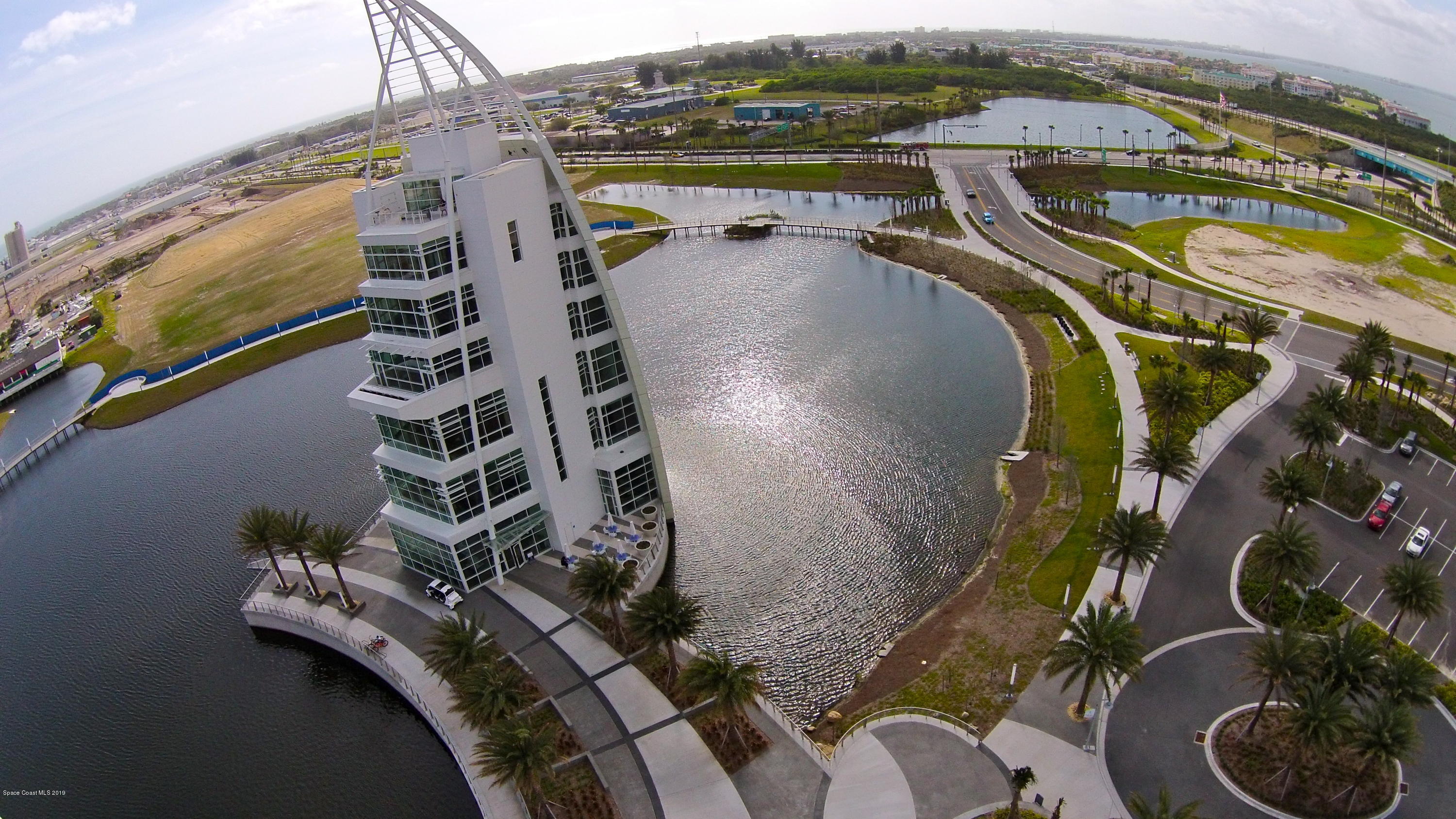 4570 Ocean Beach Boulevard, Unit 106 Cocoa Beach, FL 32931 - Photo 34 of 39 an aerial view of residential houses with outdoor space
