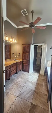 a bathroom with a sink and a large mirror