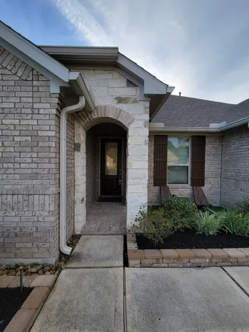 a large kitchen with stainless steel appliances granite countertop a stove a sink and a refrigerator