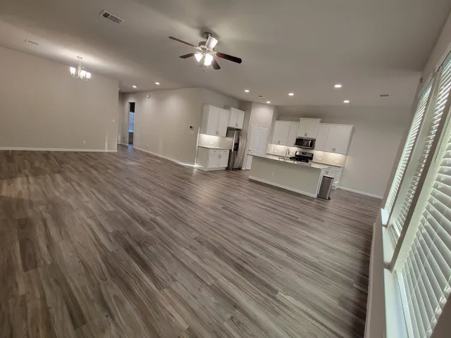 a view of a hallway to a window