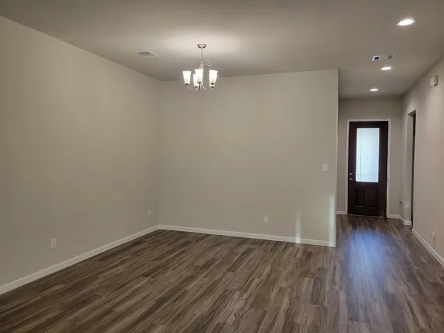 a view of a livingroom with a ceiling fan and window
