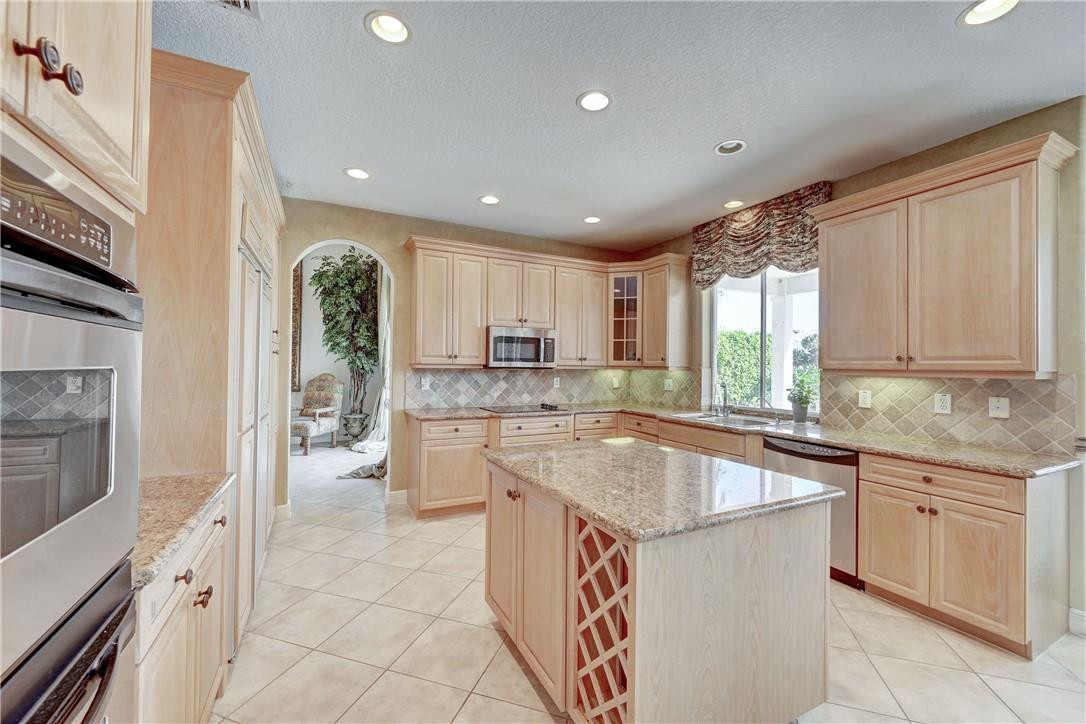 19168 Skyridge Circle Boca Raton, FL 33498 - Photo 13 of 55 a kitchen with a sink stove and cabinets