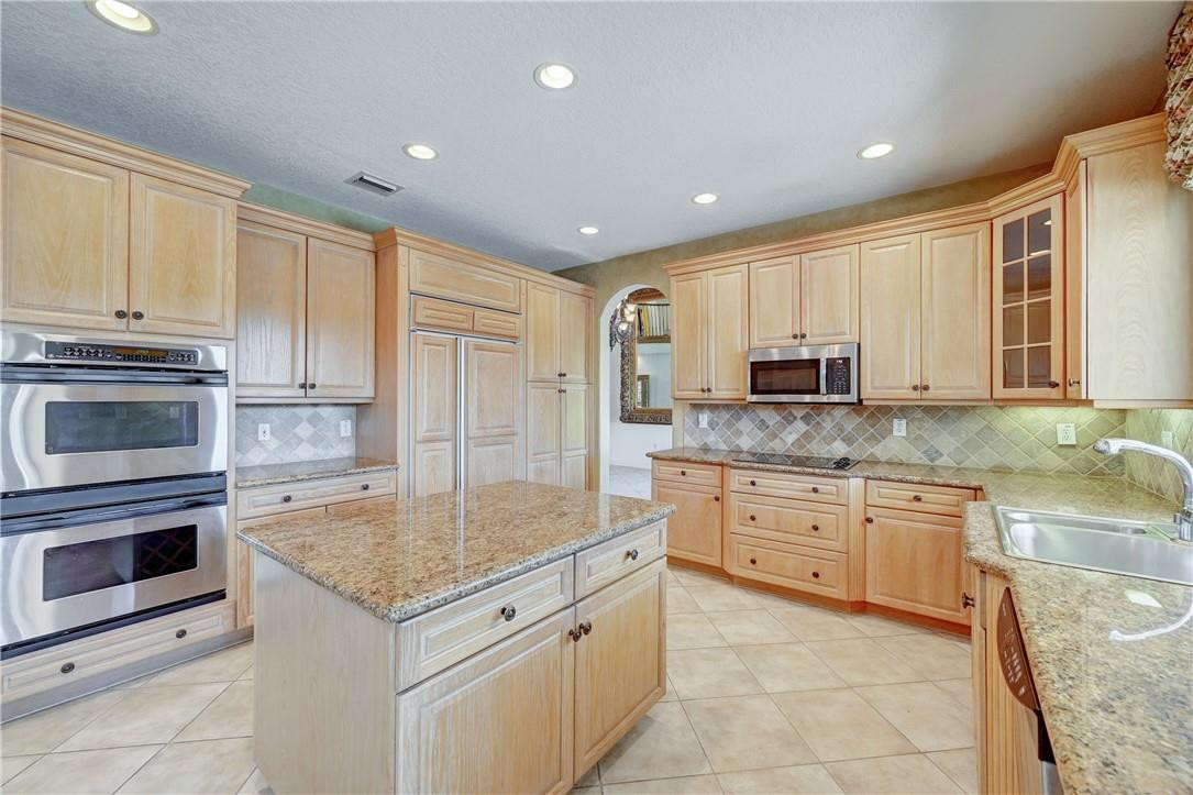 19168 Skyridge Circle Boca Raton, FL 33498 - Photo 14 of 55 a kitchen with granite countertop cabinets stainless steel appliances and a counter space