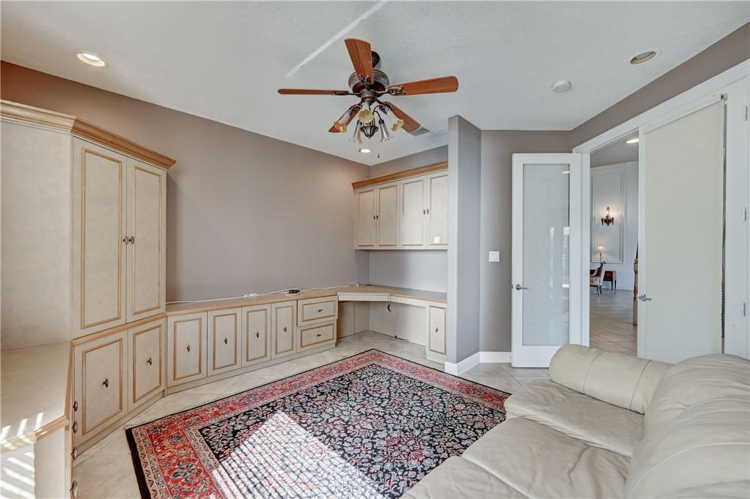 19168 Skyridge Circle Boca Raton, FL 33498 - Photo 19 of 55 a view of a hallway with a couch and a chandelier